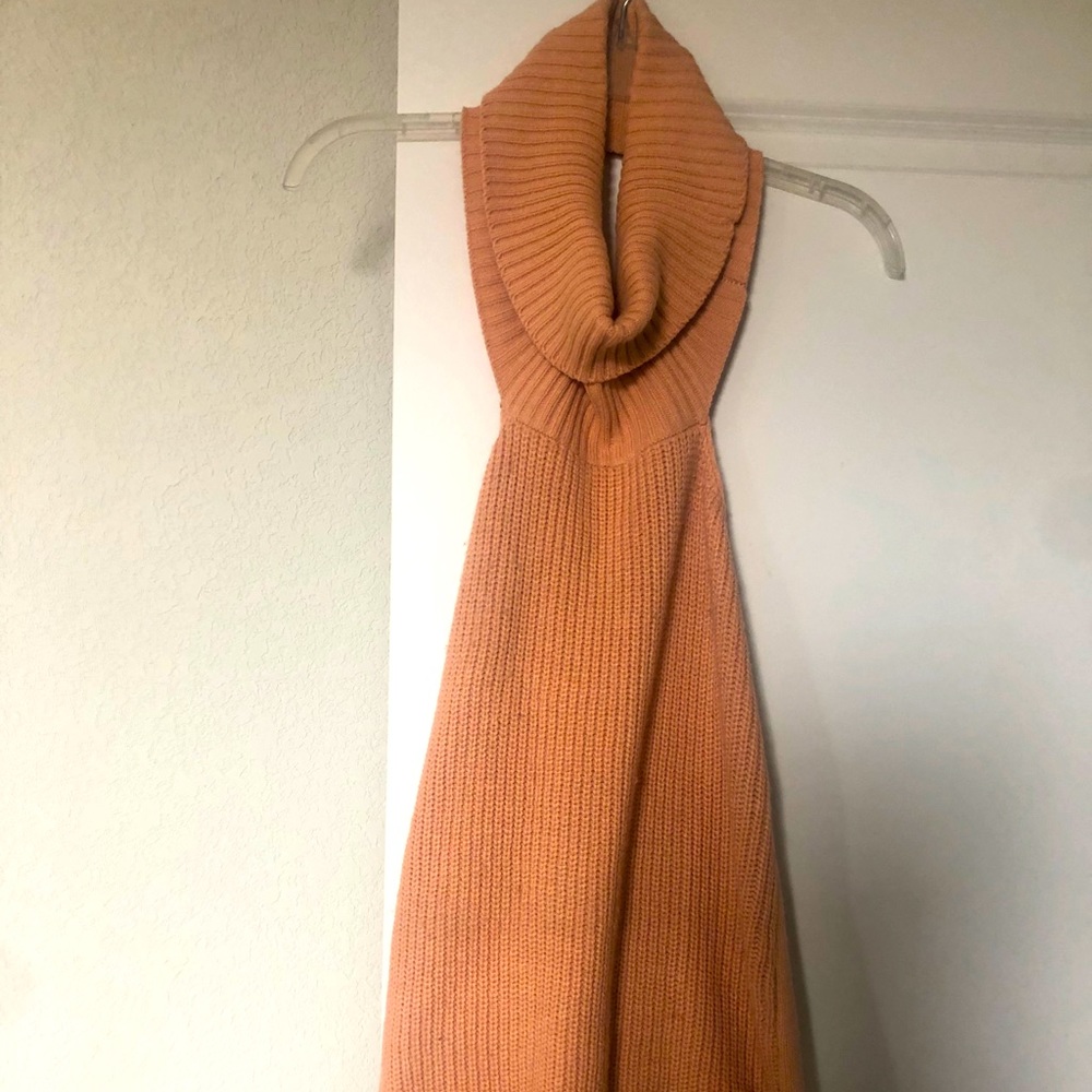Sleeveless turtleneck with open back